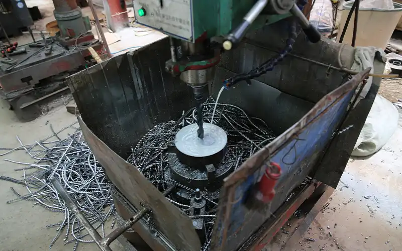 CNC drilling of barbell plate center hole at ShuangJia factory