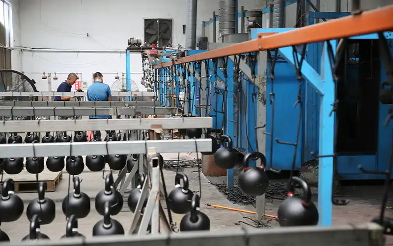 Kettlebell assembly and finishing station at ShuangJia factory