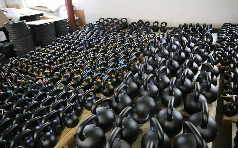 Packed and palletized kettlebells ready for global shipping from the factory