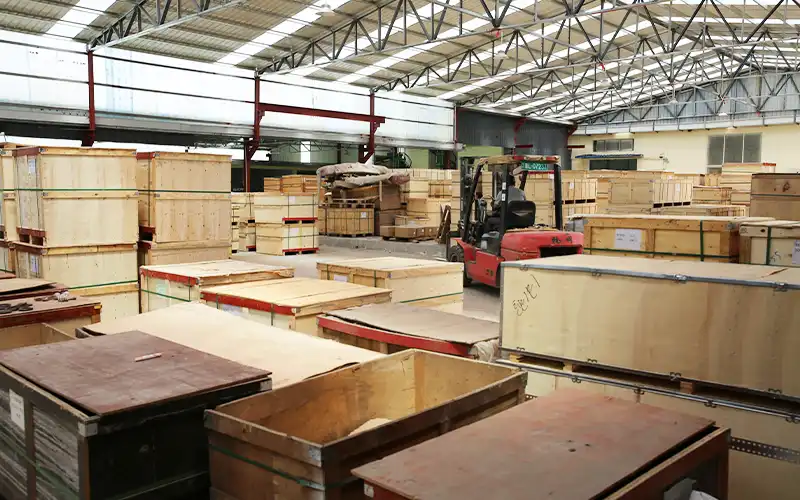 Fitness equipment packed on pallets ready for export shipping, showing the factory-direct buying process